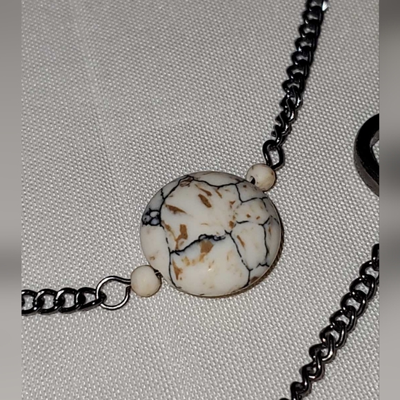 Gunmetal necklace with open shapes adorned with jasper, turquoise, and howlite. - Picture 7 of 9